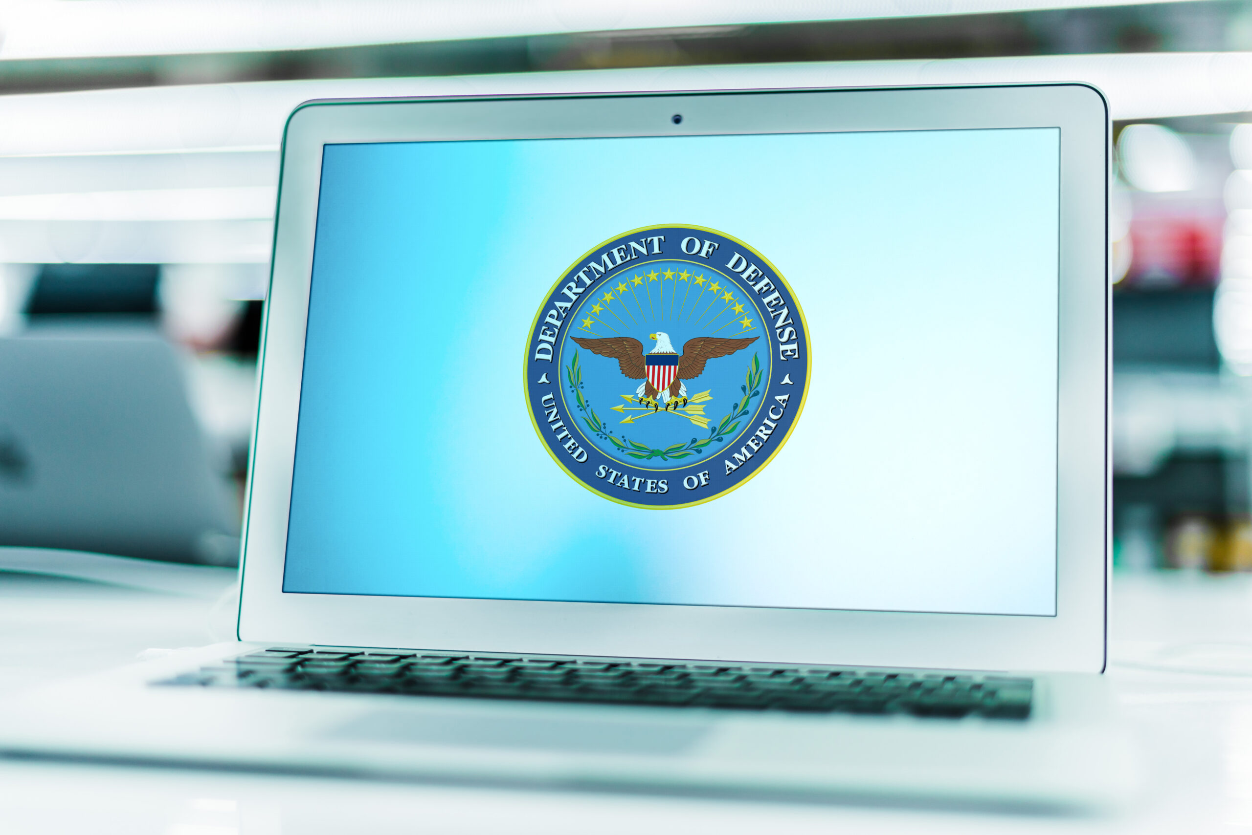 Laptop computer displaying logo of The US Department of Defense